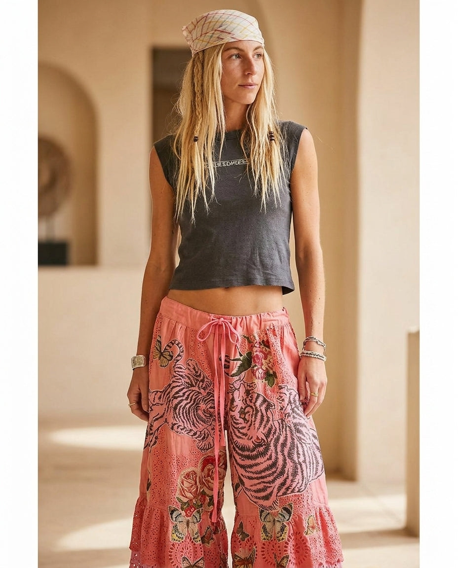 Pink Gleam Resort Eyelet Pants Pink Pants with Asymmetric silhouette and Textured texture, editorial ecommerce scene for Resort Wear, Evening in Amalfi, Euro Chic Premium by Mesadic