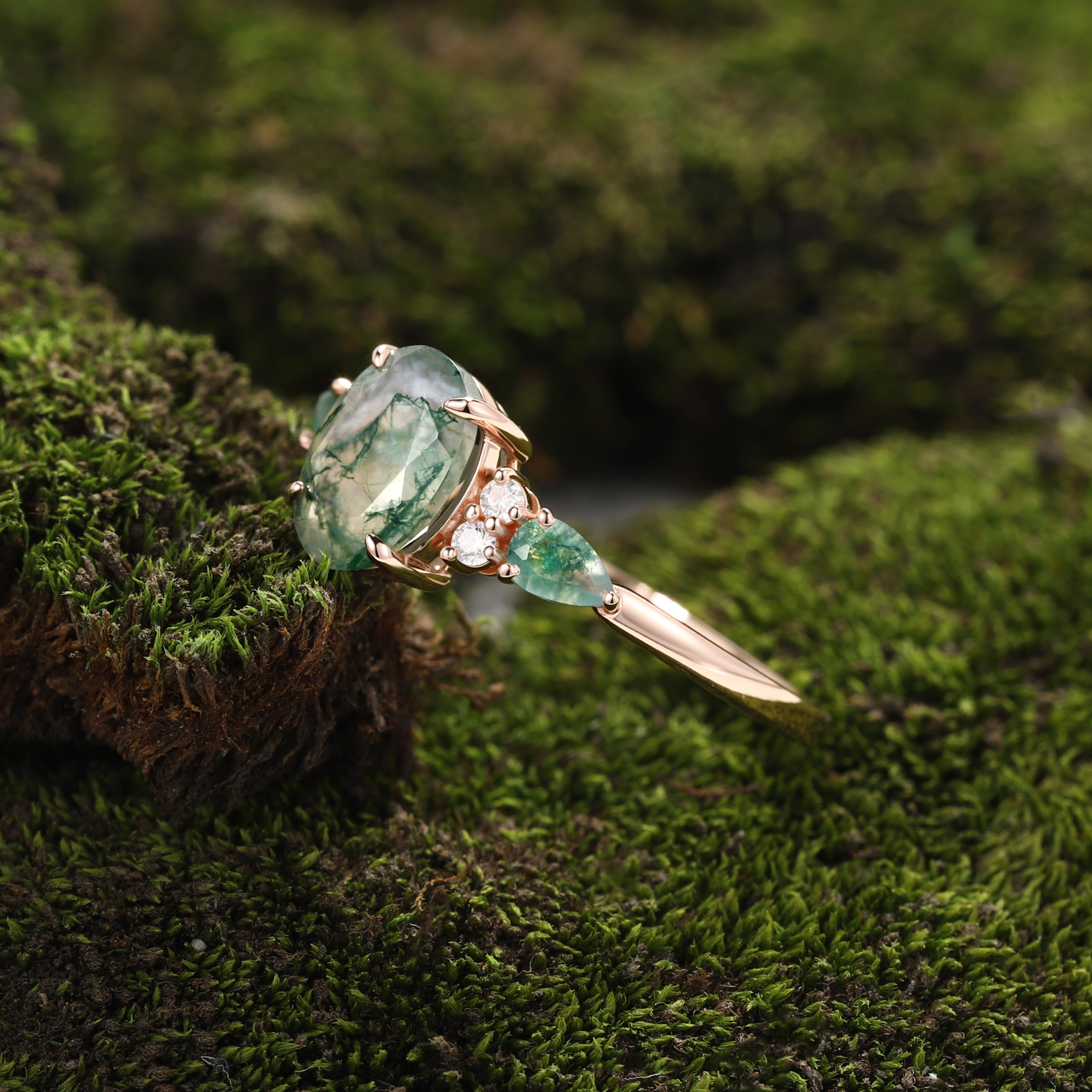 Rose Gold Natural Oval Cut Moss Agate Three-Stone Ring with Pear Side Stones & Moissanite Accents | Nature-Inspired Engagement Ring