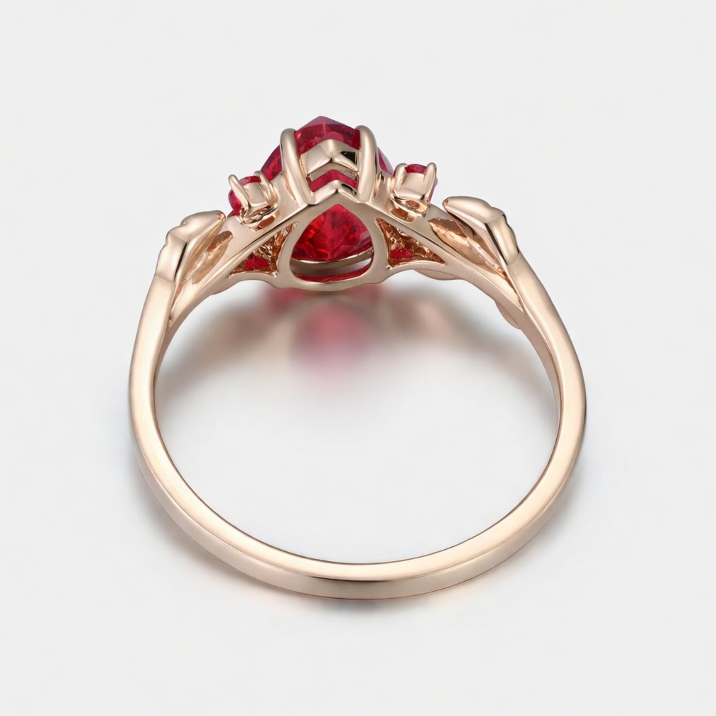 Lucky Pear Ruby Engagement Ring in Rose Gold | Intricate Leaf Vine Botanical Design with Ruby Accents