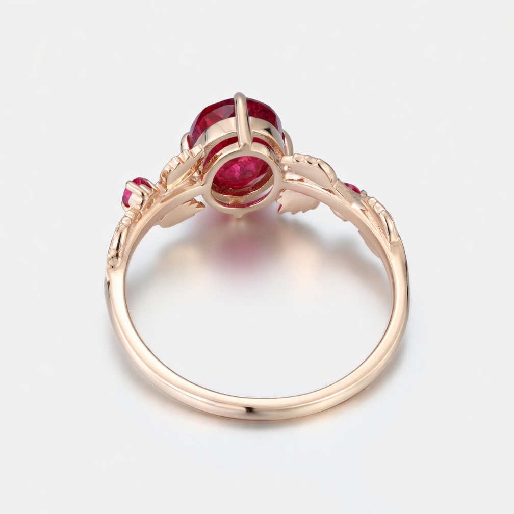 Lucky Oval Lab Grown Ruby Engagement Ring in Rose Gold | Exquisite Leaf Vine Botanical Design with Ruby Accents
