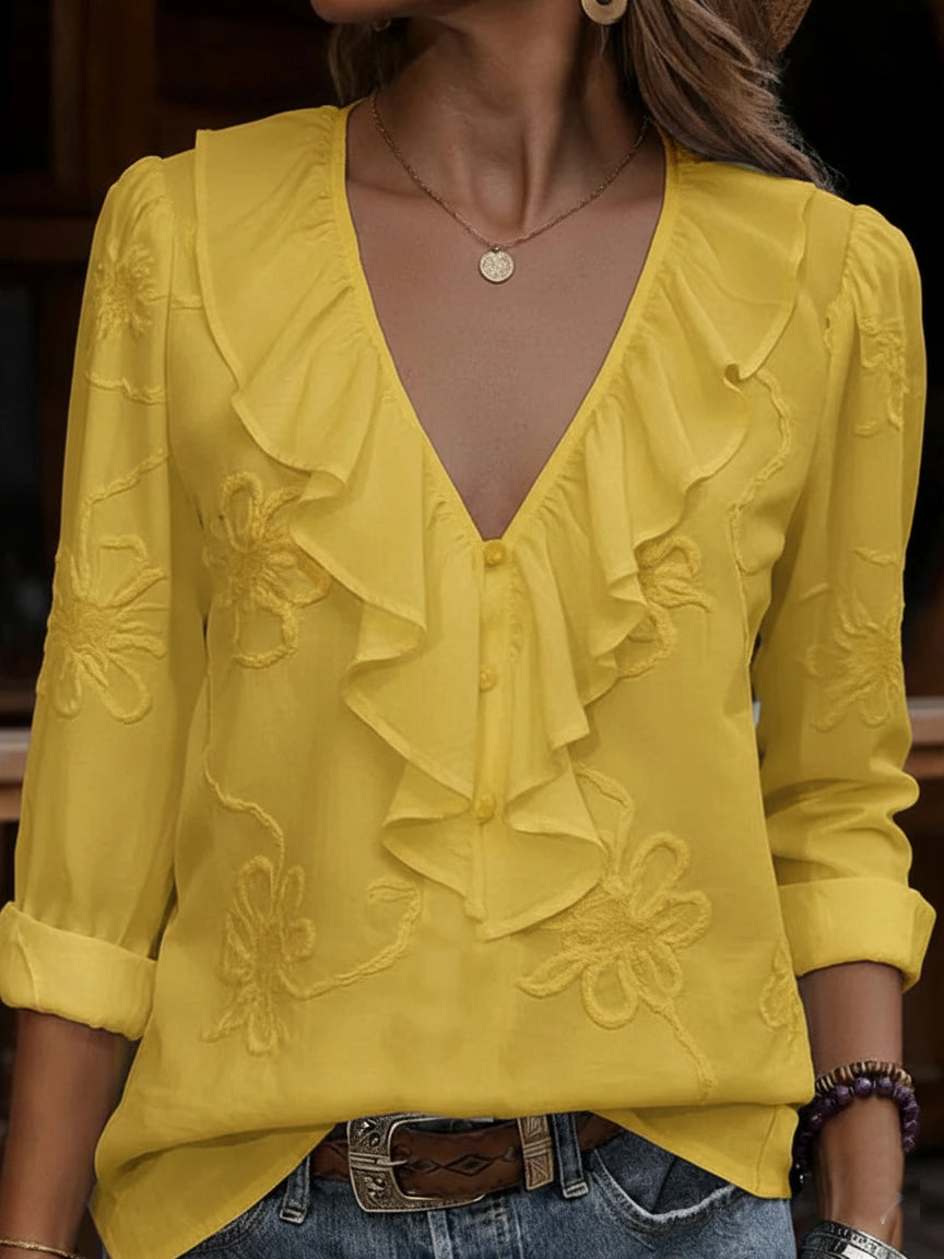 ruffled V-neck shirt with embroidered flowers