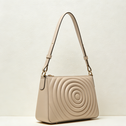 Okrągła pikowana torebka na ramię