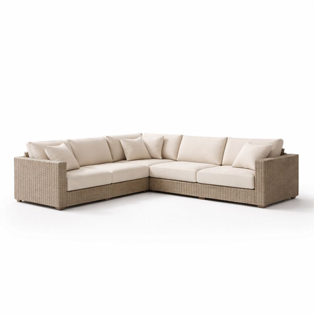 Divano angolare in rattan crema con cuscini