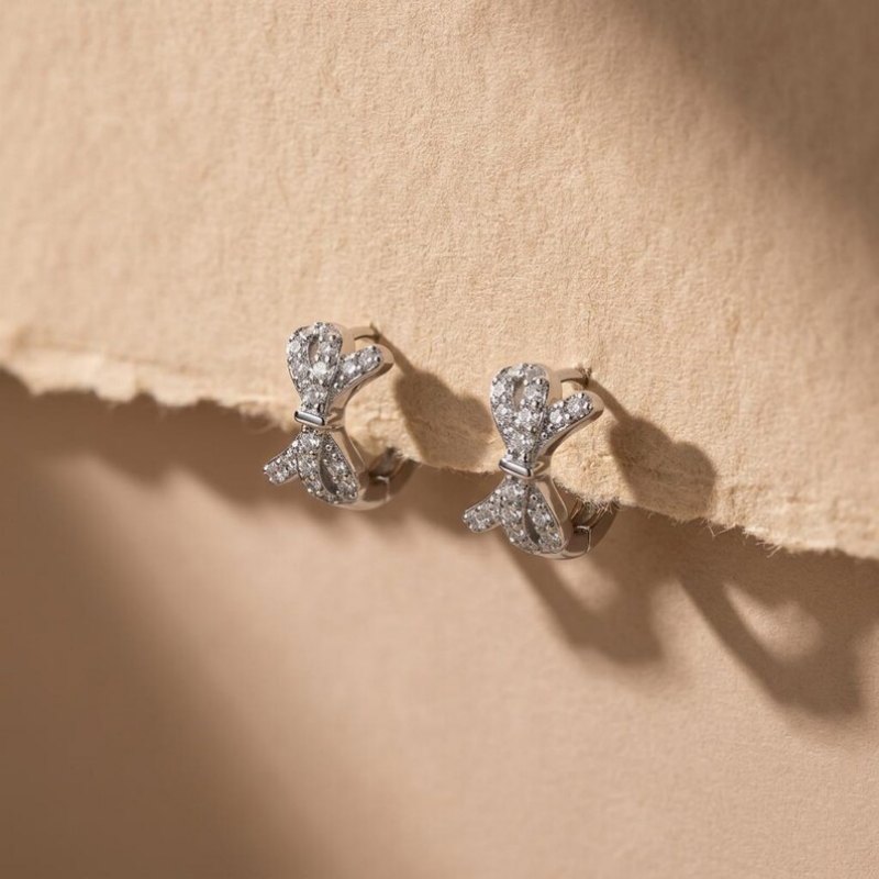 Round Cut Diamond White 925 Sterling Silver Bow Knot Huggie Earrings