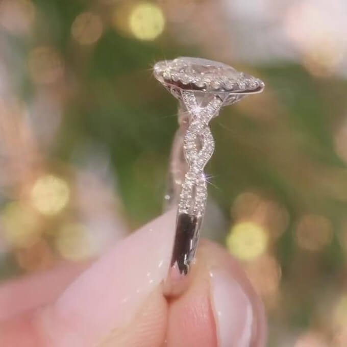 Pear Cut Diamond White Sterling Silver Twisted Halo Engagement Ring