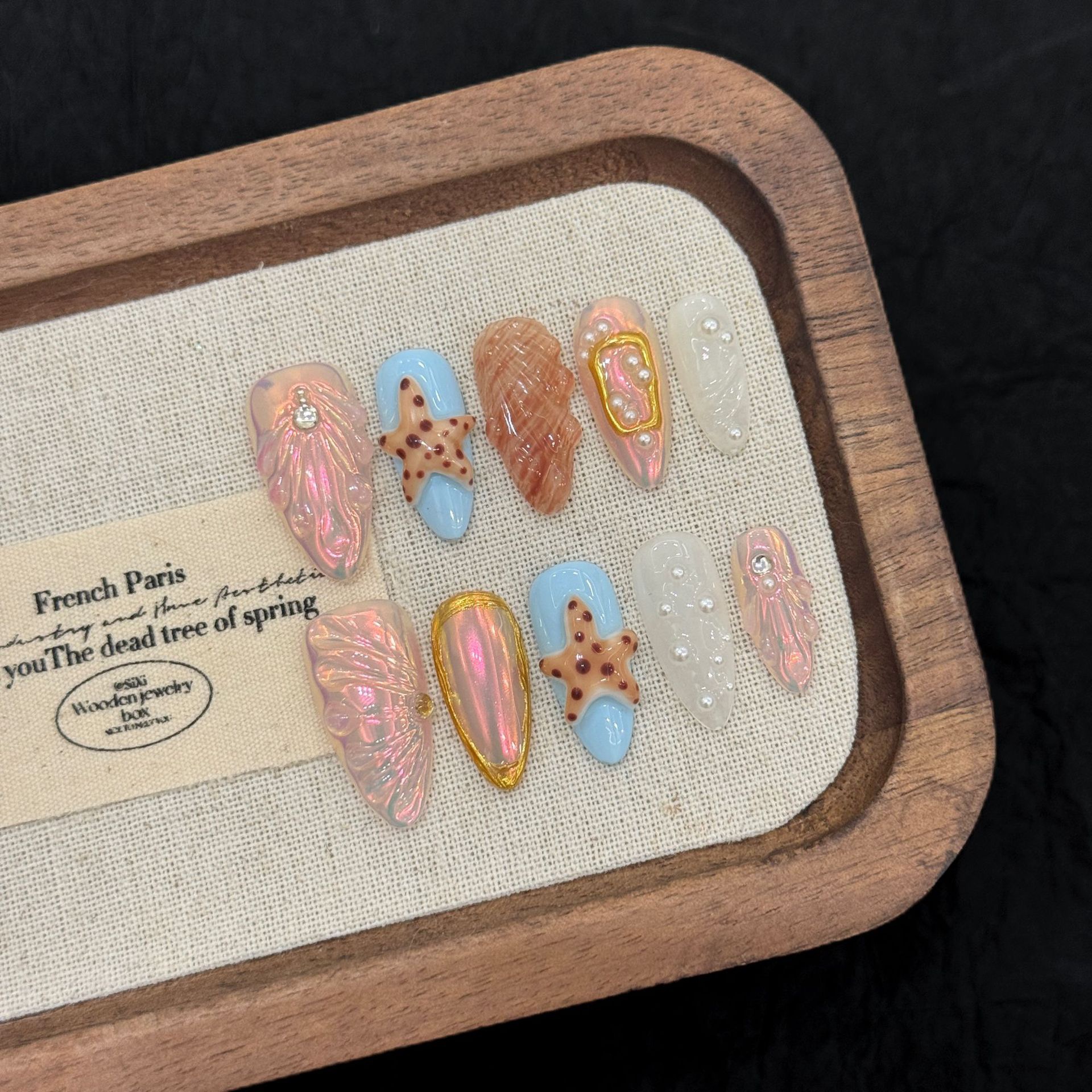 : Long Teardrop-Shaped Rhinestones & French Manicure Style