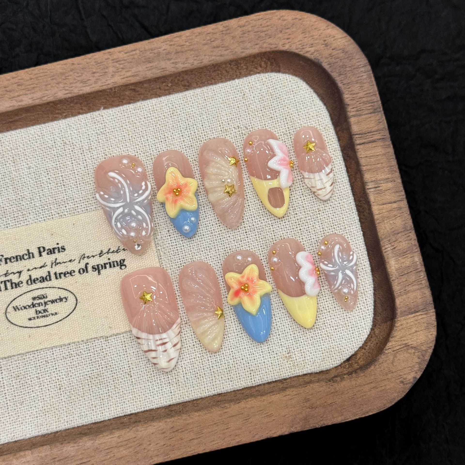 : Long Teardrop-Shaped Rhinestones & French Manicure Style