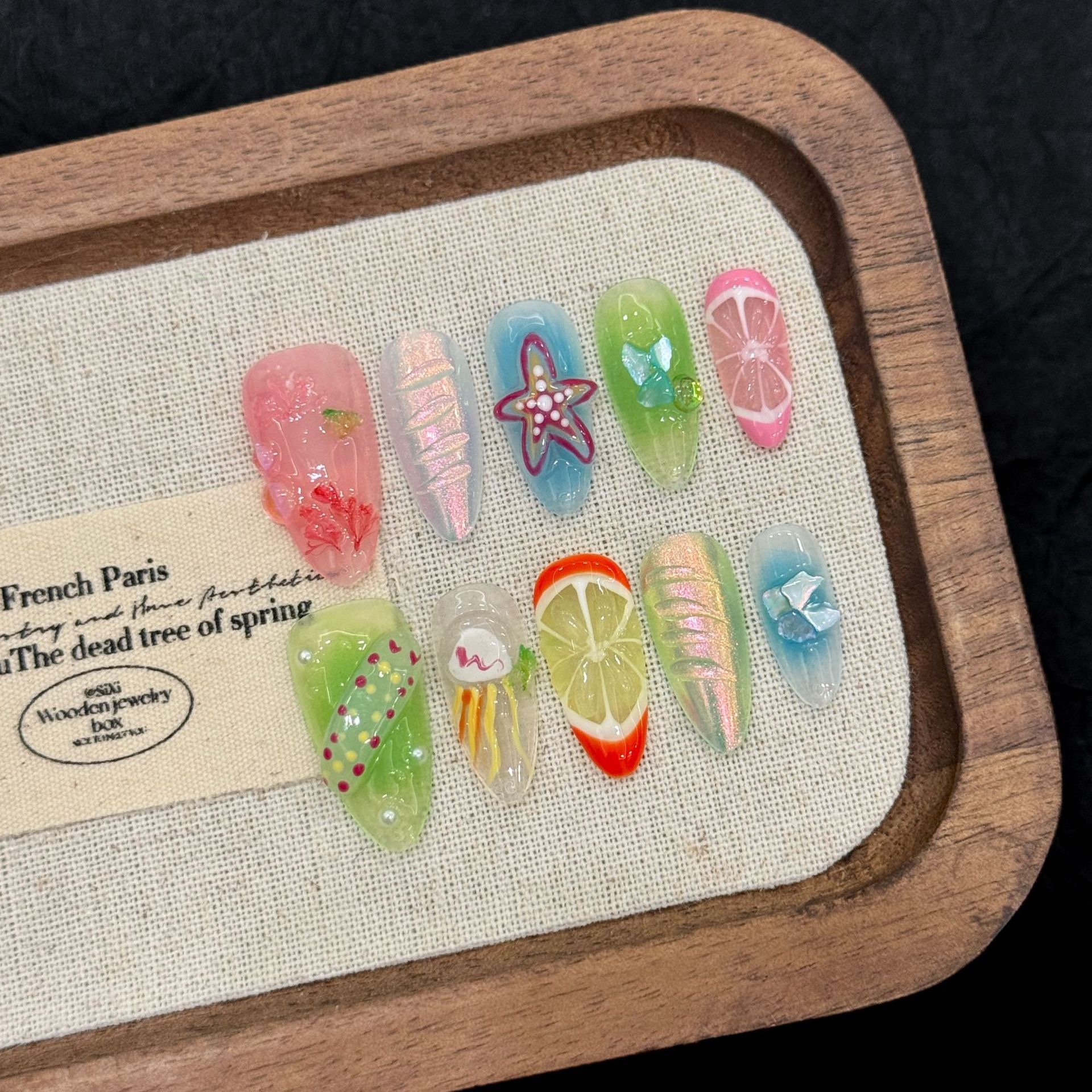 : Long Teardrop-Shaped Rhinestones & French Manicure Style