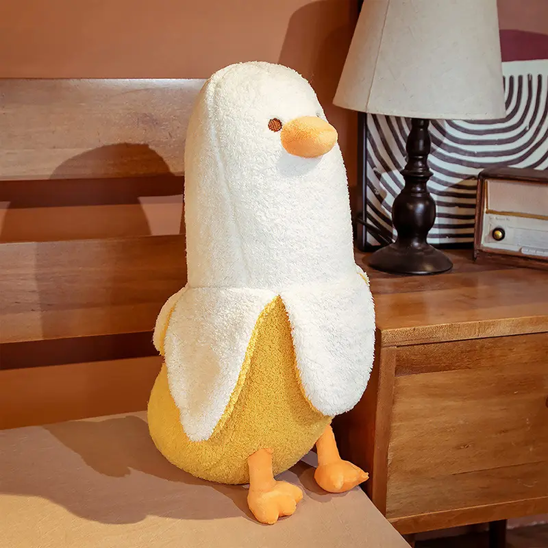Cute Banana Duck Plush Stuffed Animal Toy for HomeDecoration Squishy Plushie Toy Comfort Plush for Gifts Soft Huggable for Parent-Child Interaction Couples & Friends Prank Toy Party Fun Gift for Kids & Adults Stuffed Animals