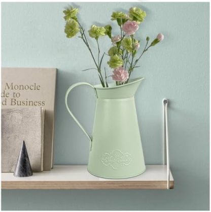Green AnnieGarden metal pitcher vase styled with seasonal stems
