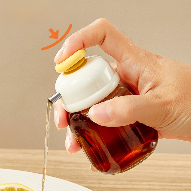 Botella exprimible de aceite con control de flujo