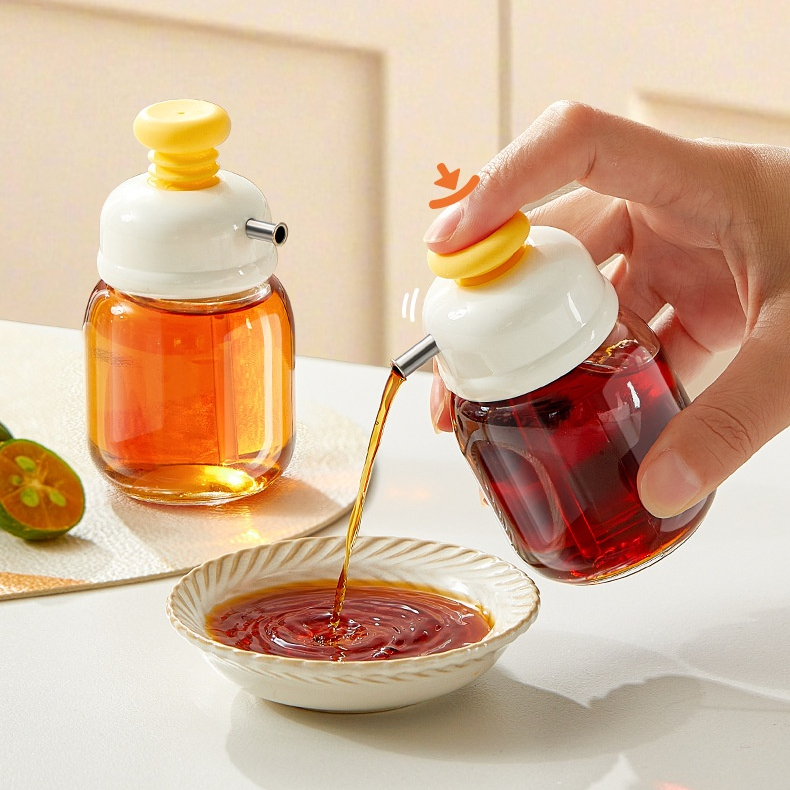 Botella exprimible de aceite con control de flujo