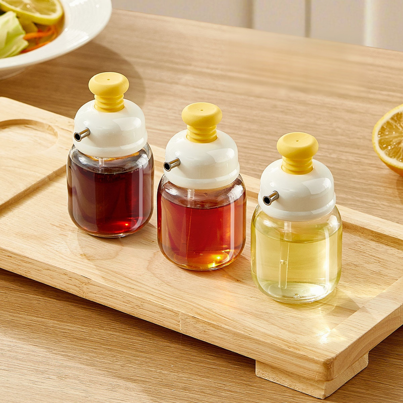 Botella exprimible de aceite con control de flujo