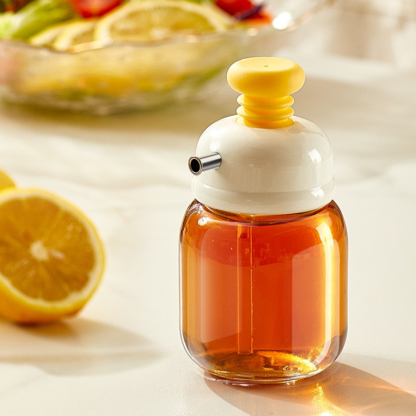 Botella exprimible de aceite con control de flujo