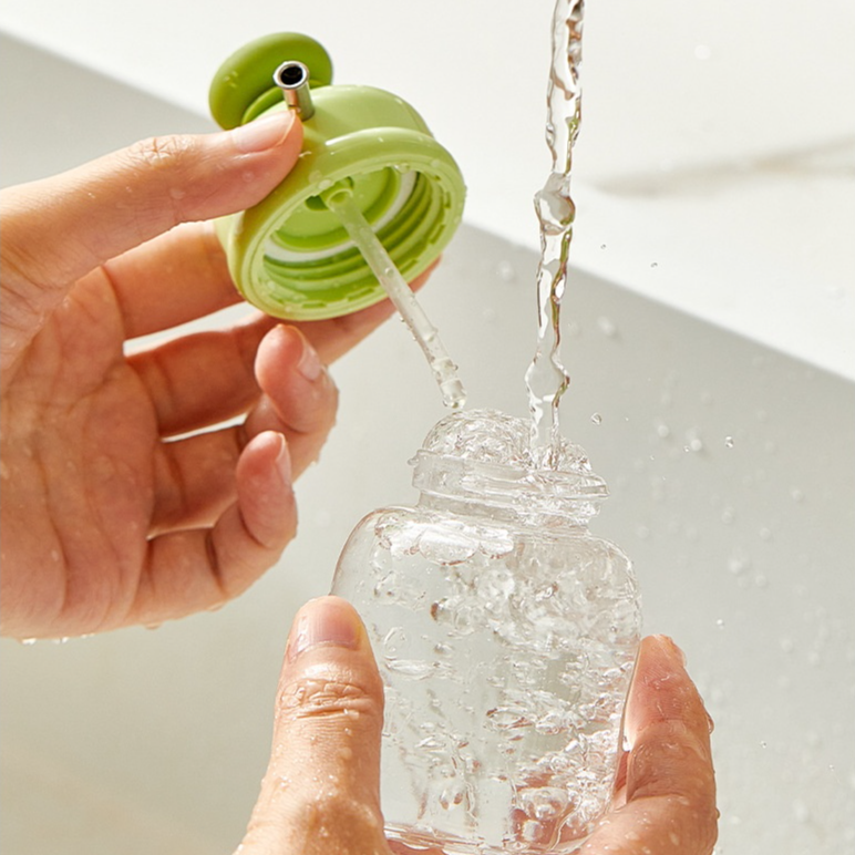 Botella exprimible de aceite con control de flujo