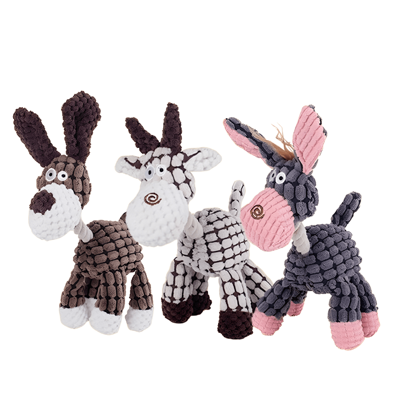 Four animal-themed dog toys on a white background
