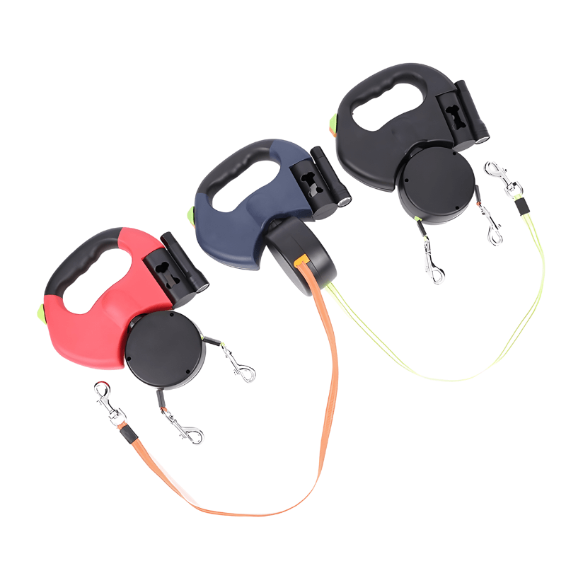 Three retractable dog leashes in red, blue, and black on a white background