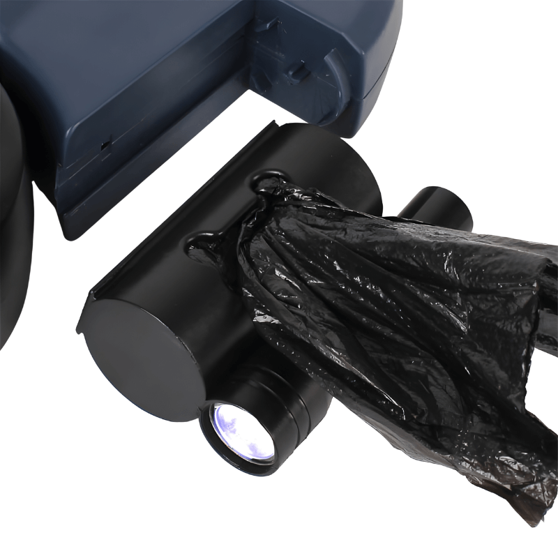 Close-up of a black trash bag hanging from a vehicle's waste bin on a white background