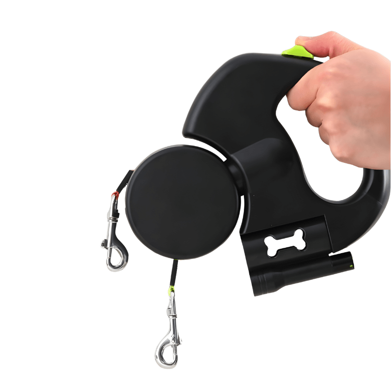 Black retractable dog leash with a hand holding it on a white background