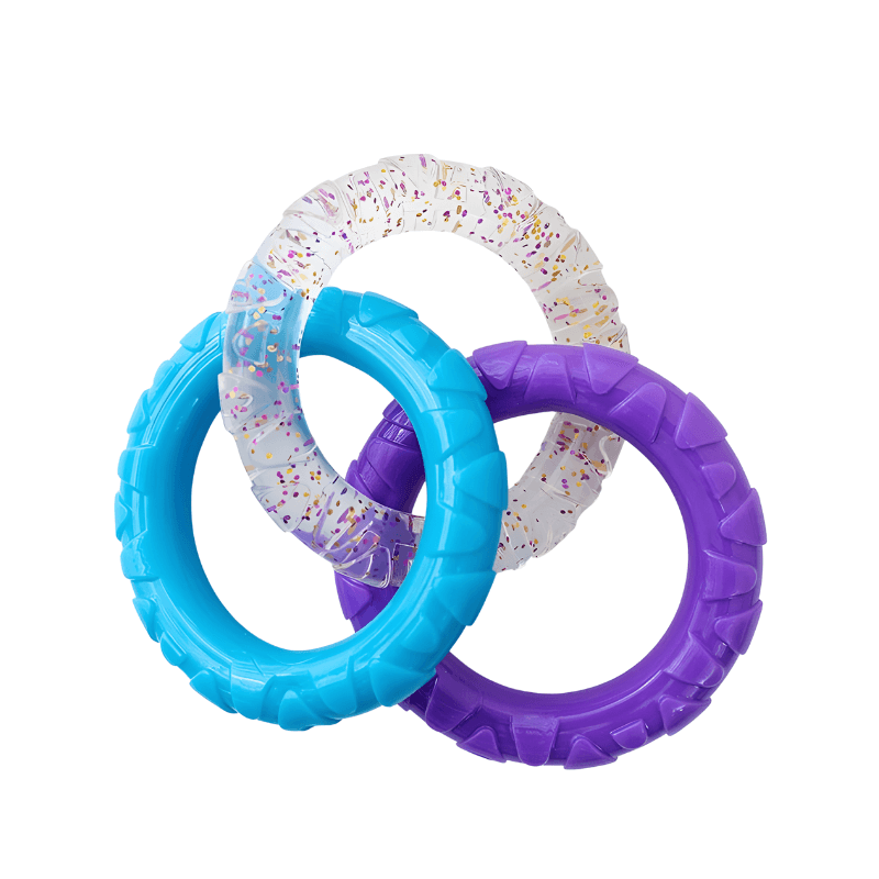 Three colorful rubber rings on a white background