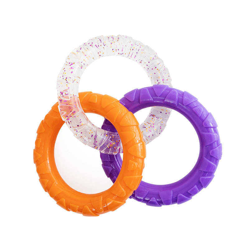 Three colorful rubber rings on a white background