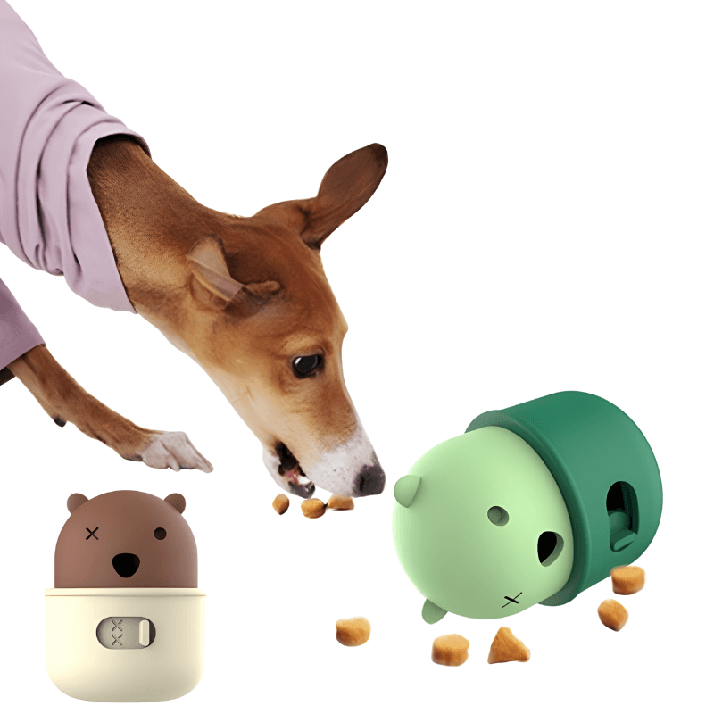 Dog interacting with two small animal-shaped containers on a white background