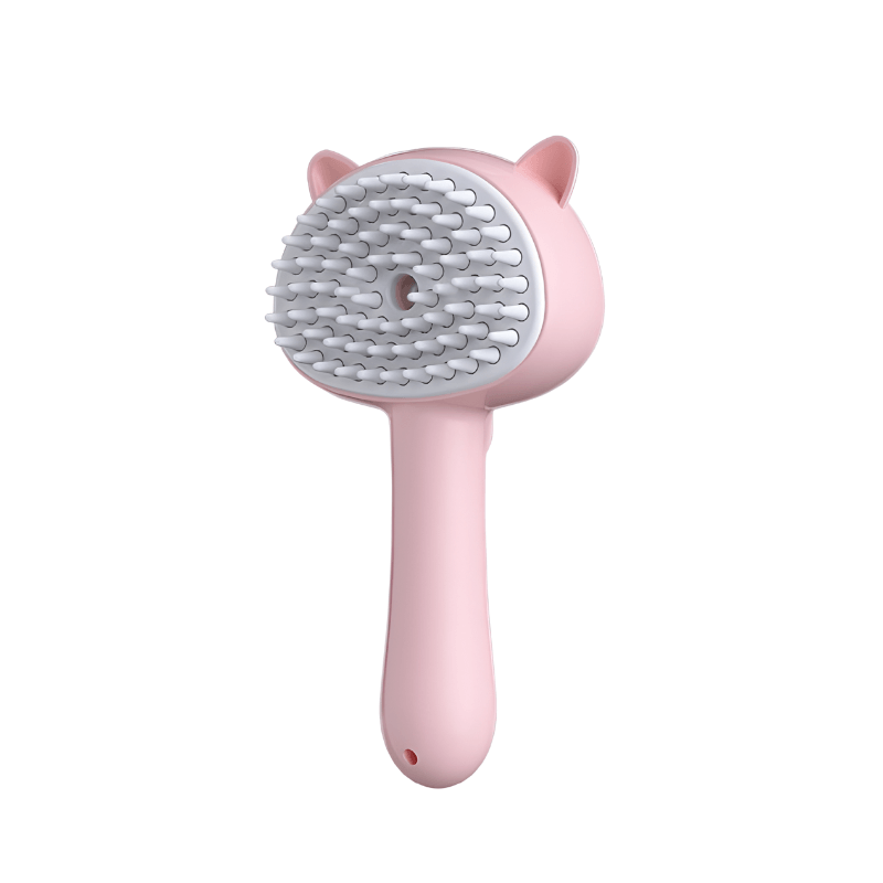 Pink pet grooming brush with a white background