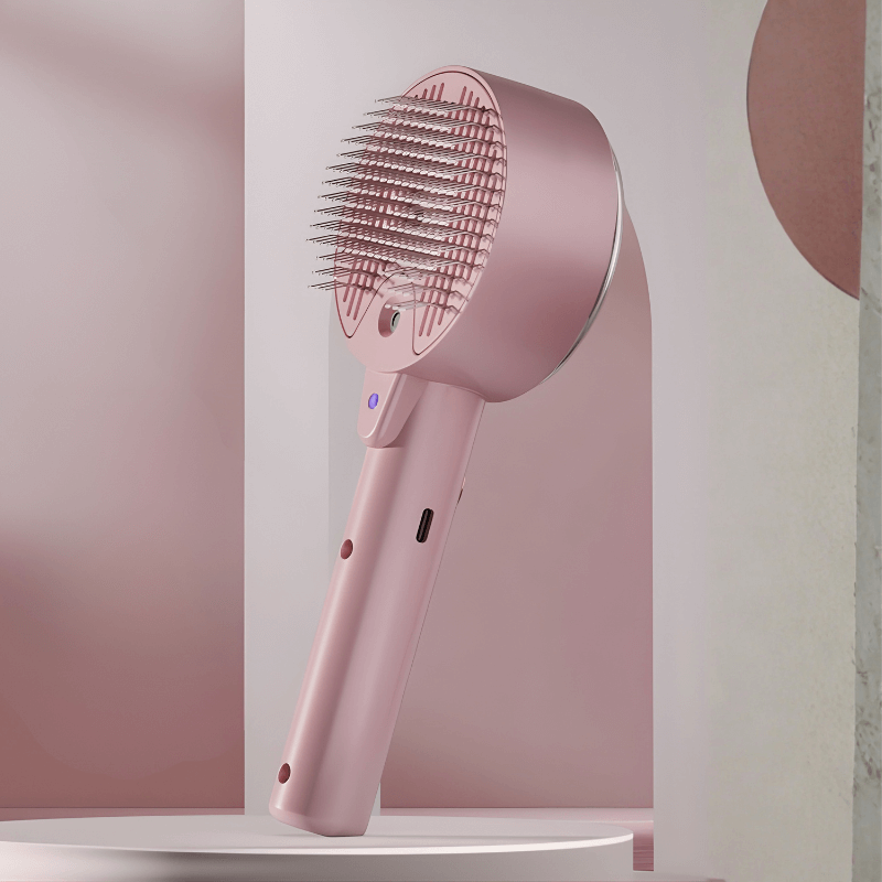 Pink hairbrush with bristle head on a white platform against a light pink background
