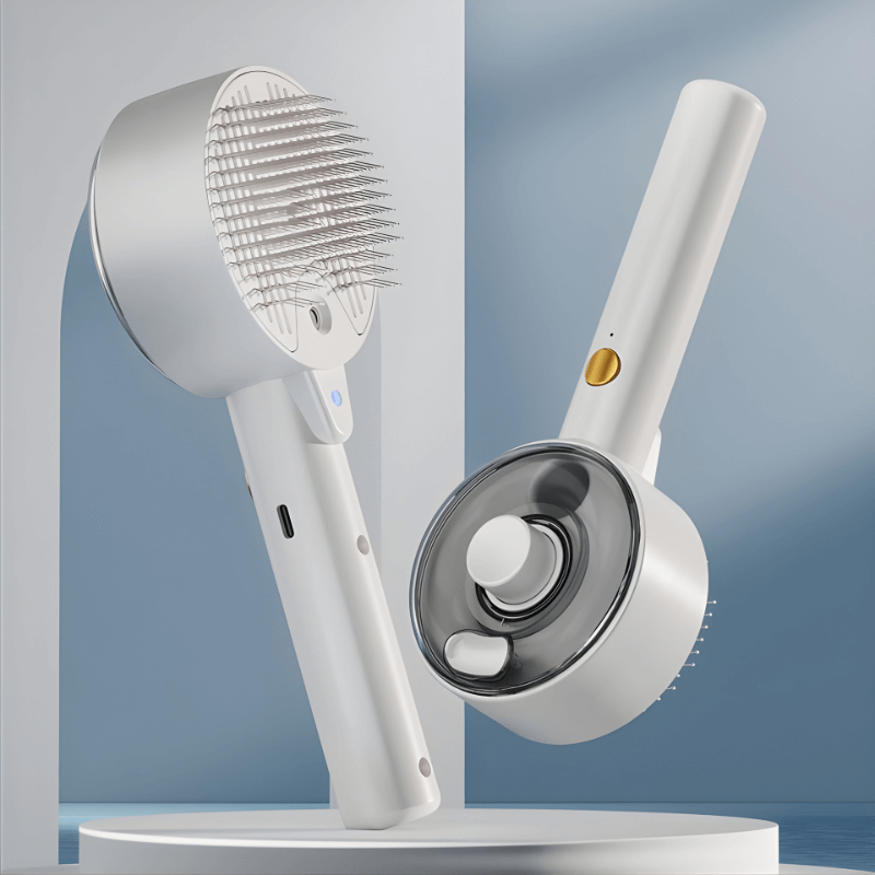 White handheld grooming tool with bristle brush and circular massager on a gray background