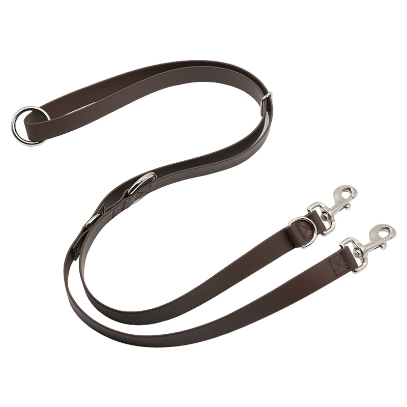 Brown leather dog leash with metal clips on a white background