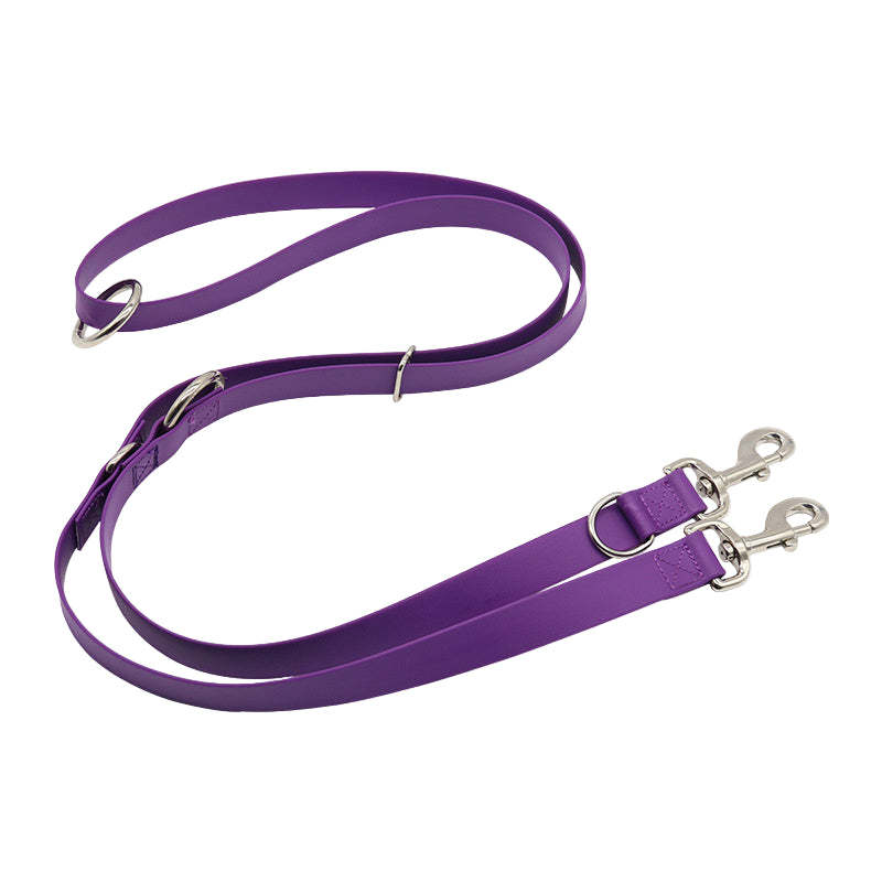 Purple dog leash with silver clips on a white background