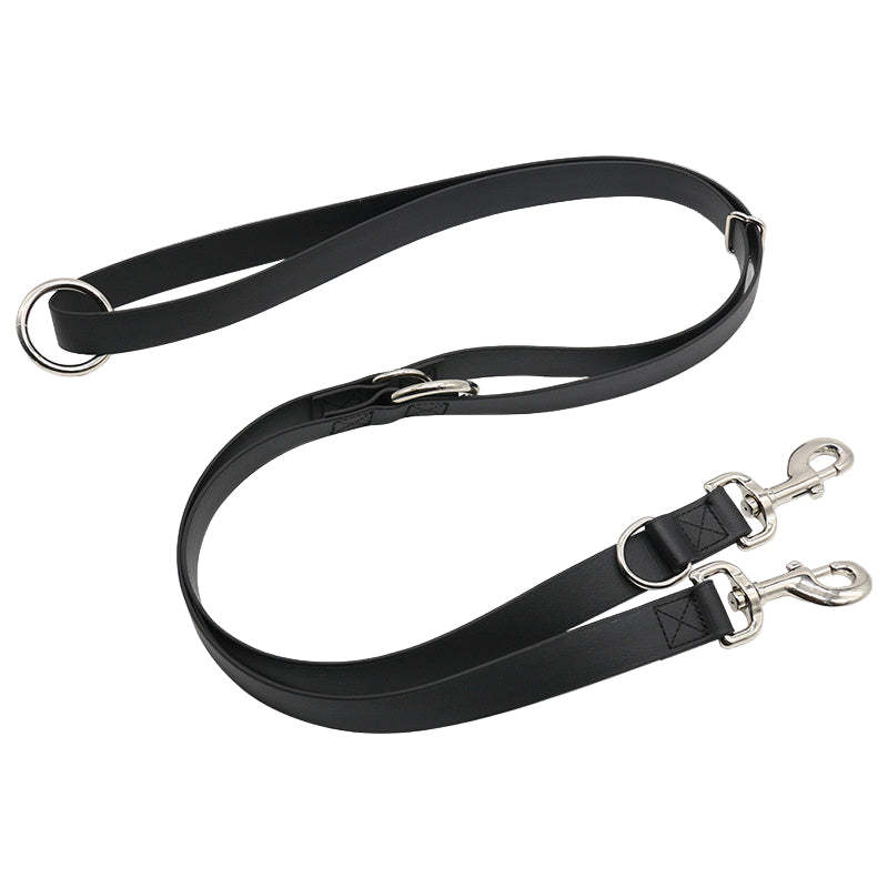 Black leather dog leash with metal clips on a white background
