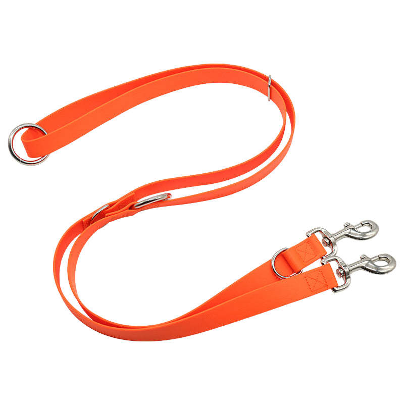 Orange dog leash with metal clips on a white background
