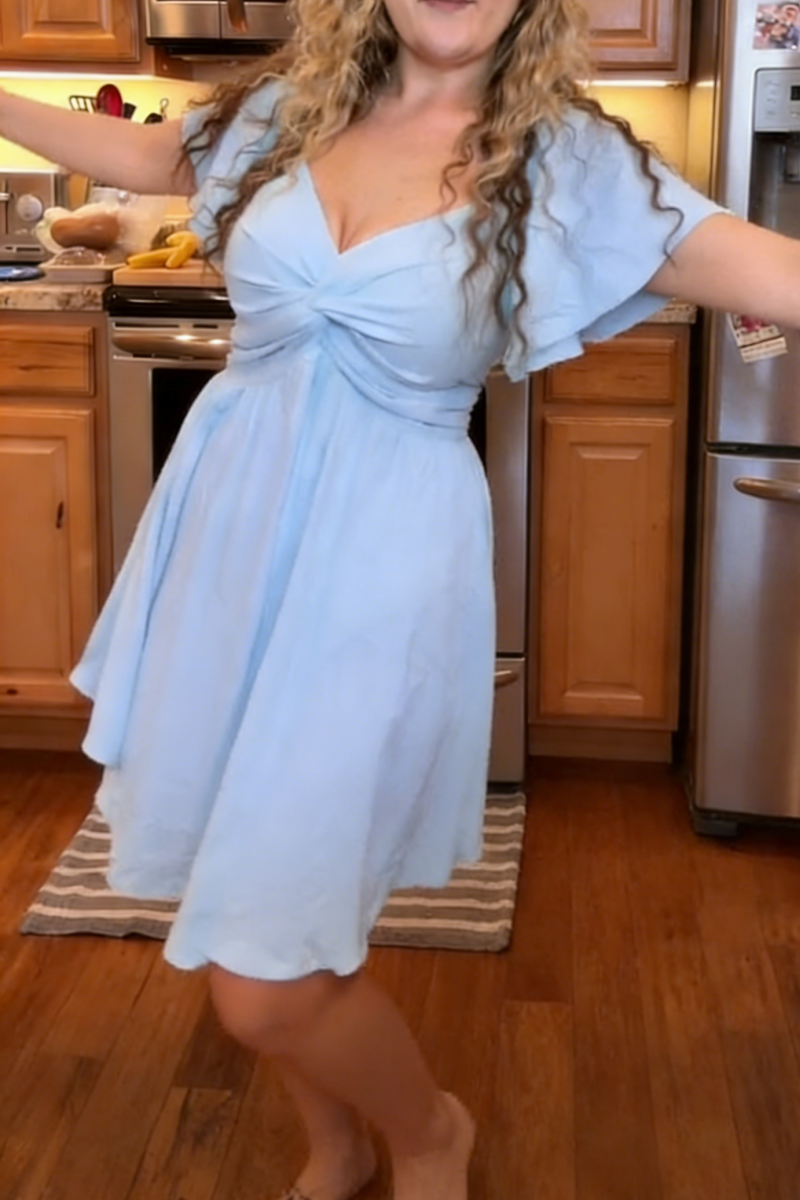 Women's summer short-sleeved high-waisted dress with a sweetheart neckline and a bow at the back a resort dress.