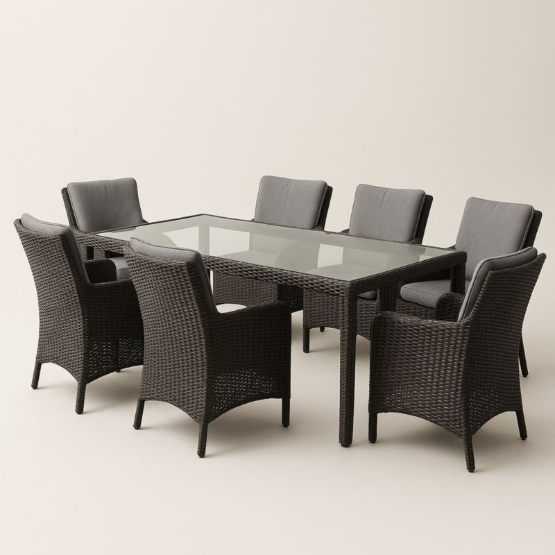 Set da pranzo rettangolare in vimini con piano in vetro temperato e 7 sedie con cuscini