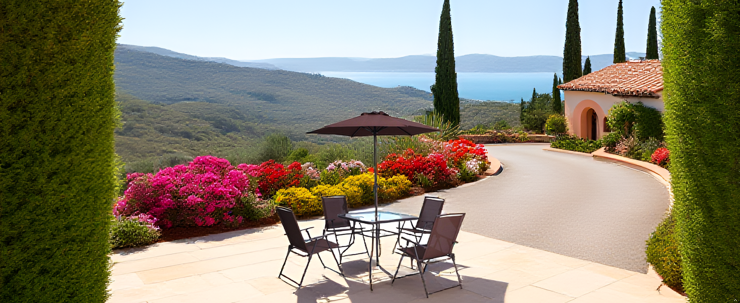 A sunlit outdoor patio with terracotta tiles, potted Mediterranean plants, and a warm golden-hour sk