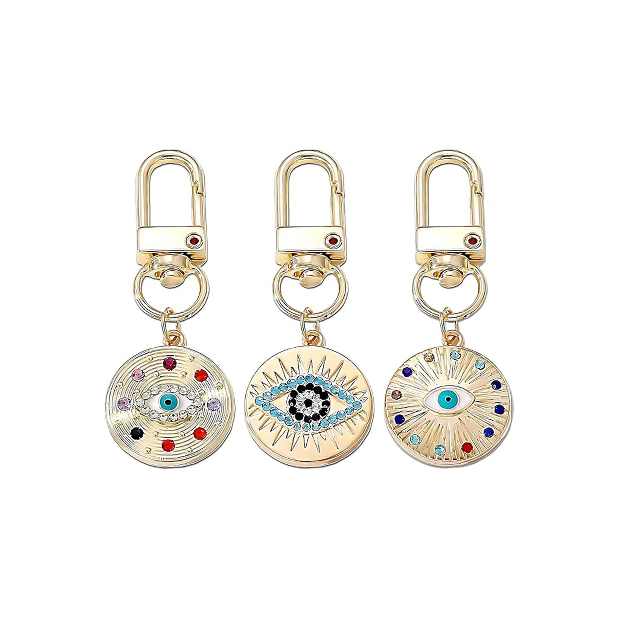 Silver Gold Evil Eye Keychain for Women Protection Good Luck Charms Key Chain for Car Keys Holder Bag Purse featuring a clean chic eye design and gold color ,perfect for daily /party/casual/office bagcharm/chain charm decoration . Styled against a white background.