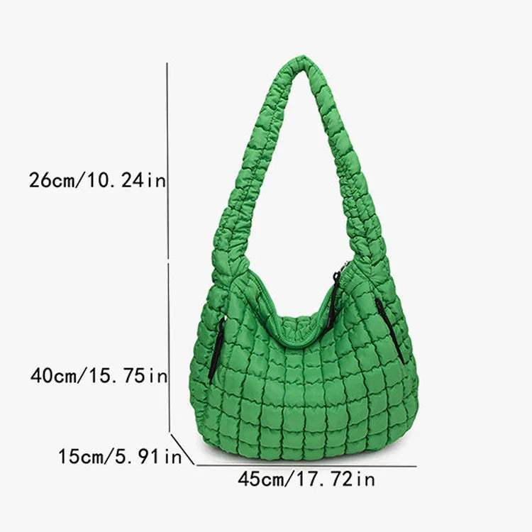Green quilted handbag with dimensions indicated on a white  freepeople coupon  sale code skirt puffer bag dress white crop top girl cute clothing mindfully outfits cottagecore  cotton good quality comfy chic vacation daily White quilted handbag on a white backgroundbackground