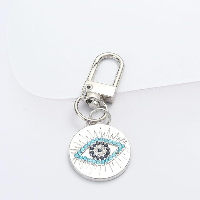 Silver Gold Evil Eye Keychain for Women Protection Good Luck Charms Key Chain for Car Keys Holder Bag Purse featuring a clean chic eye design and silver and blue color ,perfect for daily /party/casual/office bagcharm/chain charm decoration . Styled against a white  background.