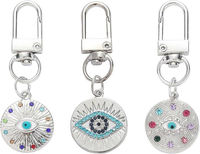 Silver Gold Evil Eye Keychain for Women Protection Good Luck Charms Key Chain for Car Keys Holder Bag Purse featuring a clean chic eye design and silver and multi color ,perfect for daily /party/casual/office bagcharm/chain charm decoration . Styled against a white background.