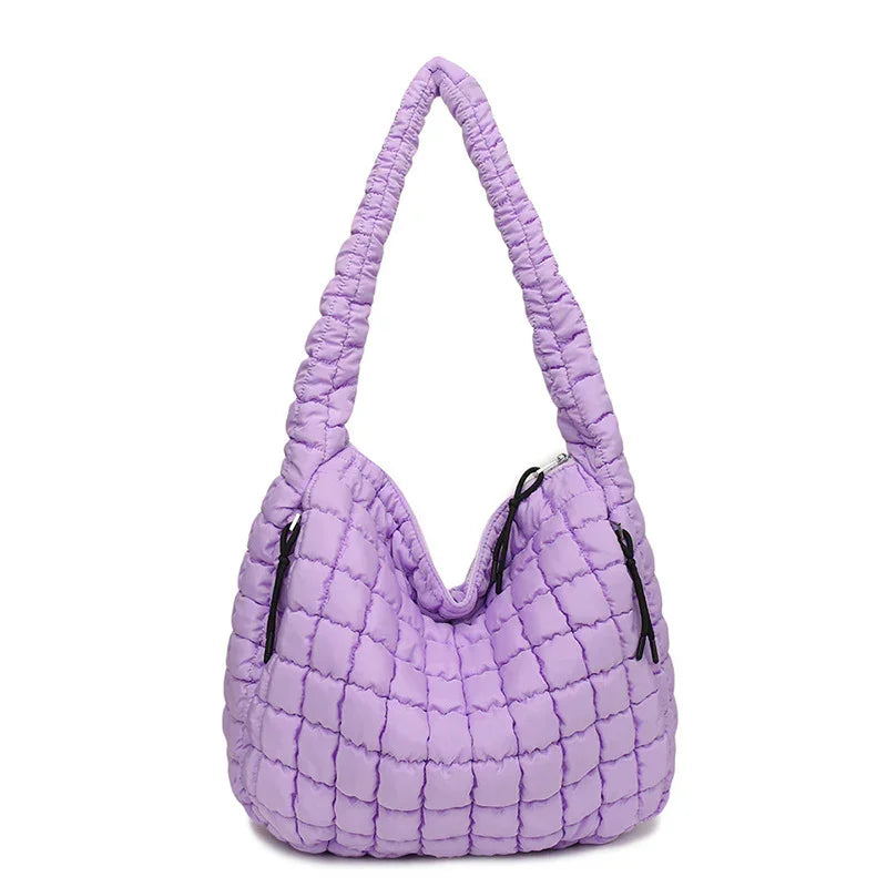 Purple quilted handbag on a white background freepeople coupon  sale code skirt puffer bag dress white crop top girl cute clothing mindfully outfits cottagecore  cotton good quality comfy chic vacation daily White quilted handbag on a white background