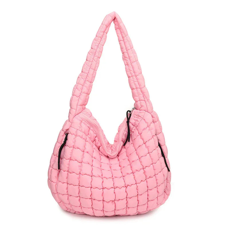 Pink quilted handbag on a white background freepeople coupon  sale code skirt puffer bag dress white crop top girl cute clothing mindfully outfits cottagecore  cotton good quality comfy chic vacation daily White quilted handbag on a white background
