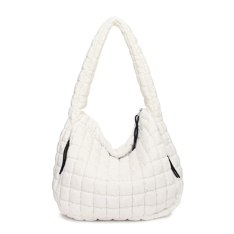 White quilted handbag on a white background freepeople coupon  sale code skirt puffer bag dress white crop top girl cute clothing mindfully outfits cottagecore  cotton good quality comfy chic vacation daily White quilted handbag on a white background
