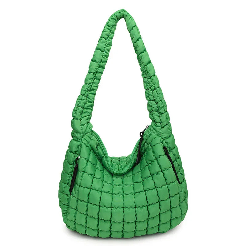 Green quilted handbag on a white background freepeople coupon  sale code skirt puffer bag dress white crop top girl cute clothing mindfully outfits cottagecore  cotton good quality comfy chic vacation daily White quilted handbag on a white background