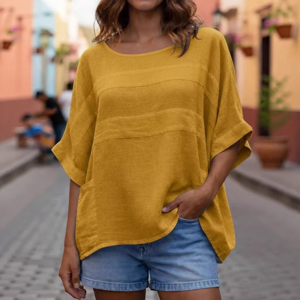 Casual, loose women's top with round neck and three-quarter sleeves