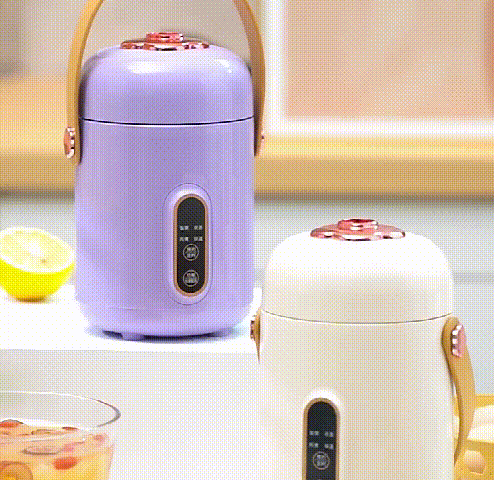 Woman using portable stewing cup at her office desk
