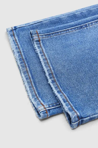 Jeansy z efektem sprania, średni stan i prosta nogawka