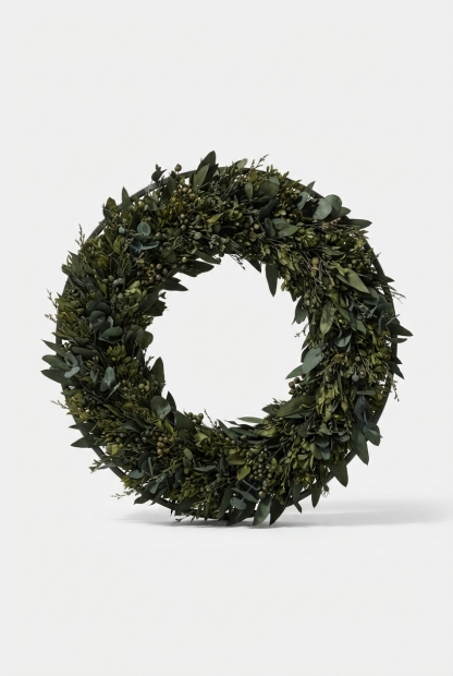 Small greenery wreath styled as a table centerpiece