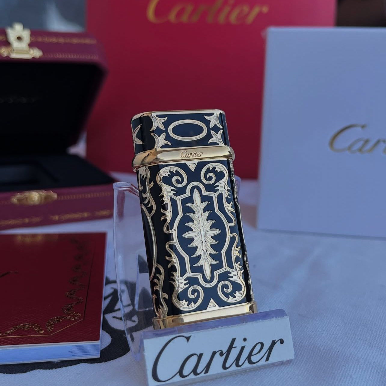 Cartier Black with Gold Engraved Pattern Luxury Lighter - Angle View