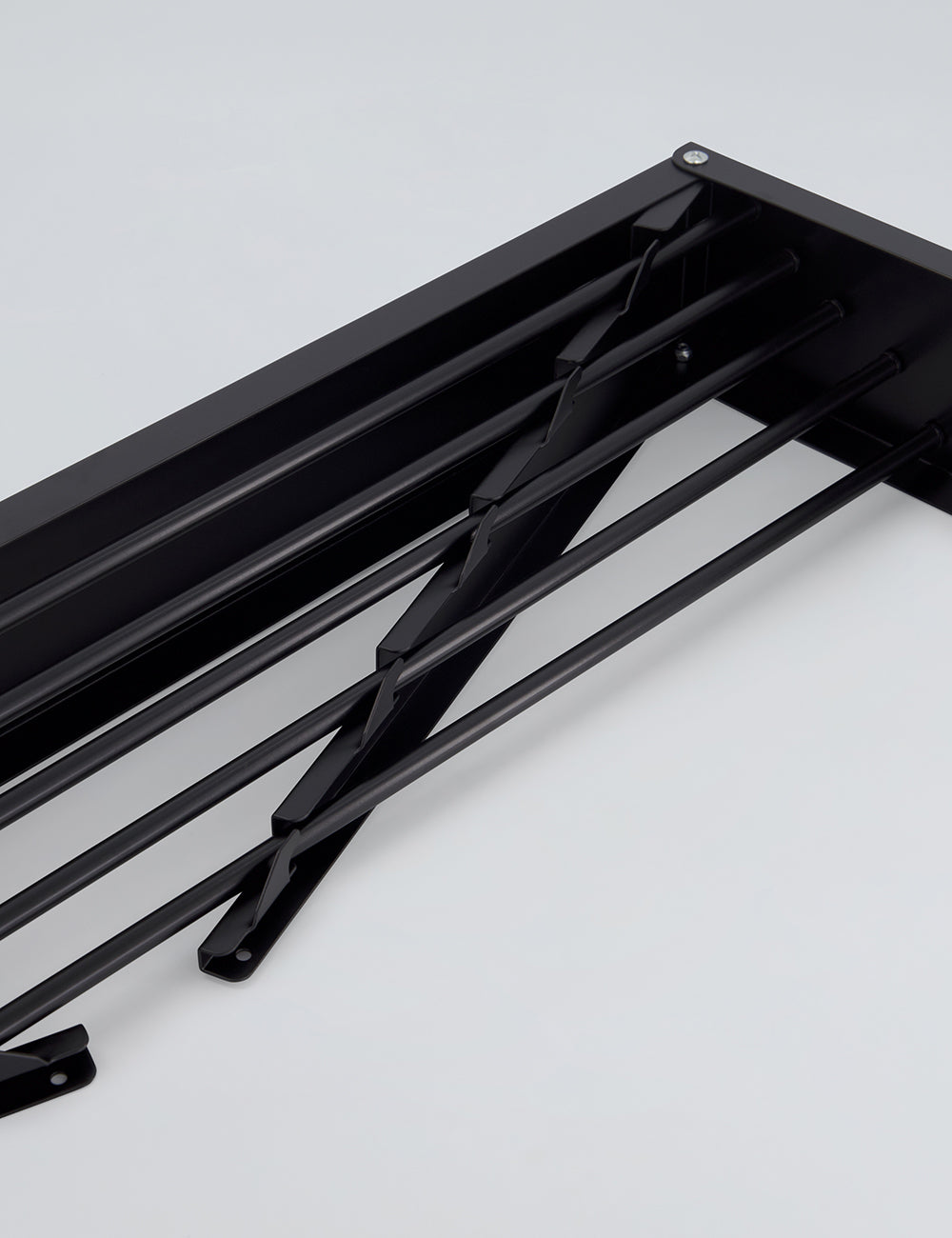 Tendedero de pared plegable para interiores y exteriores.